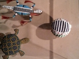 Toys made of floss in the shape of turtles and lizards